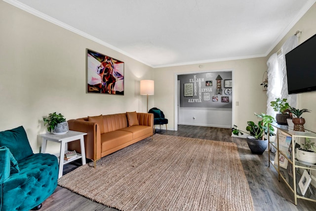 living room with ornamental molding and hardwood / wood-style floors