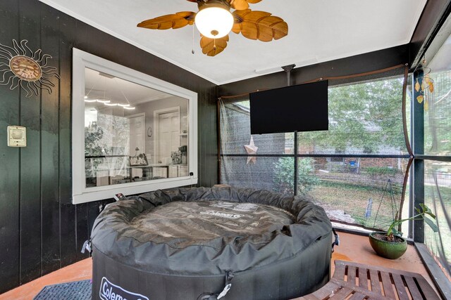 sunroom / solarium with ceiling fan and plenty of natural light