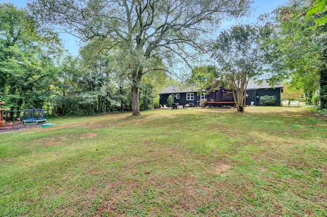 view of yard featuring a trampoline