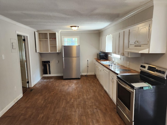 kitchen featuring a textured ceiling, dark wood-type flooring, white cabinets, stainless steel appliances, and crown molding