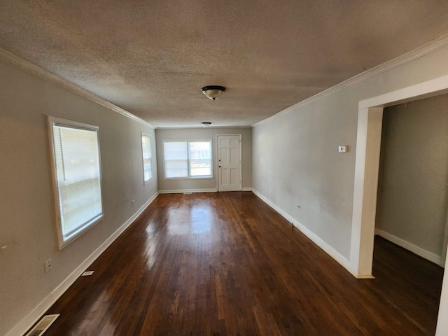 unfurnished room featuring a textured ceiling, ornamental molding, and dark hardwood / wood-style flooring