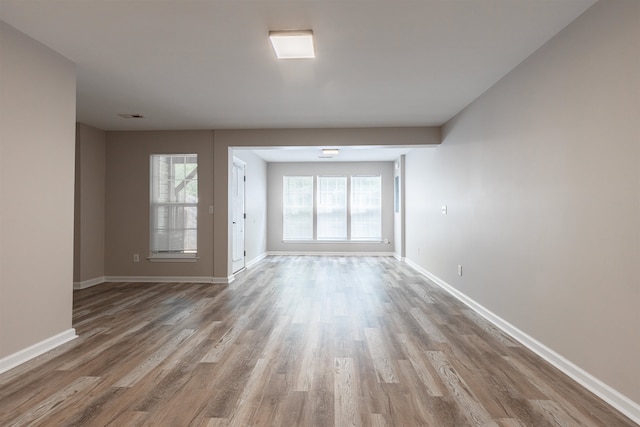 spare room with light hardwood / wood-style flooring