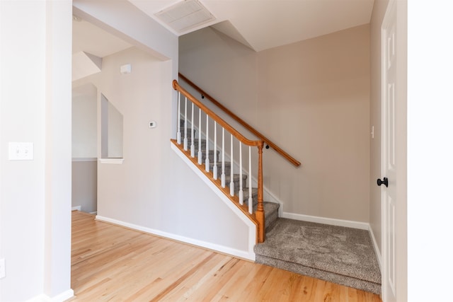 stairway featuring hardwood / wood-style flooring