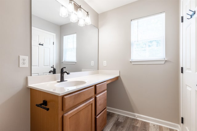 bathroom featuring vanity and hardwood / wood-style floors