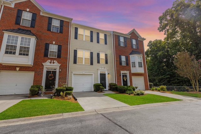 townhome / multi-family property featuring a garage