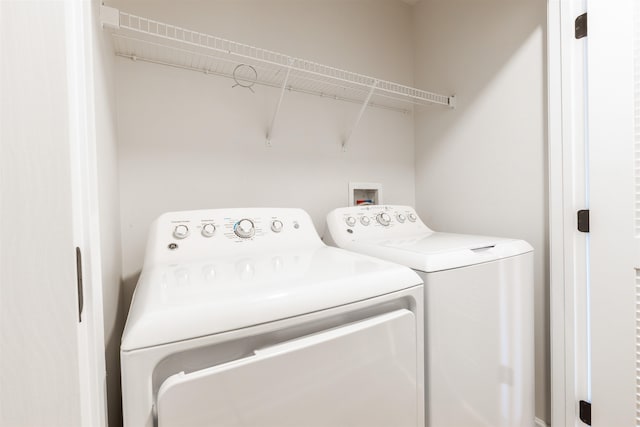 laundry room with independent washer and dryer