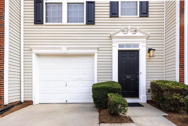 property entrance with a garage