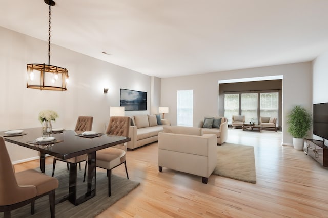 living room featuring a notable chandelier and light hardwood / wood-style floors