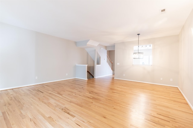 unfurnished room with light hardwood / wood-style flooring