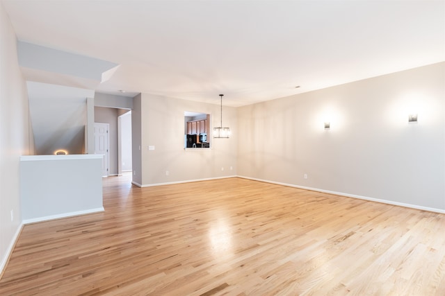 unfurnished living room with light hardwood / wood-style flooring