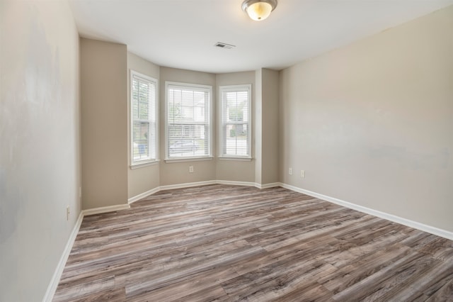 spare room featuring hardwood / wood-style floors