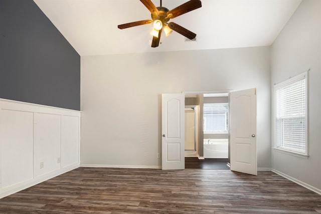 unfurnished bedroom with vaulted ceiling, ceiling fan, and dark hardwood / wood-style floors