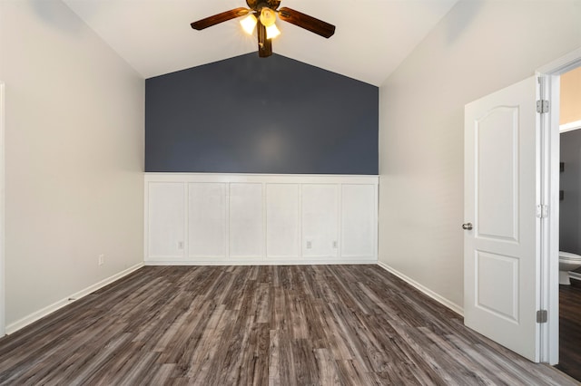 unfurnished room featuring ceiling fan, lofted ceiling, and dark wood-type flooring