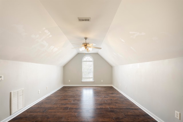 additional living space featuring vaulted ceiling, dark hardwood / wood-style flooring, and ceiling fan