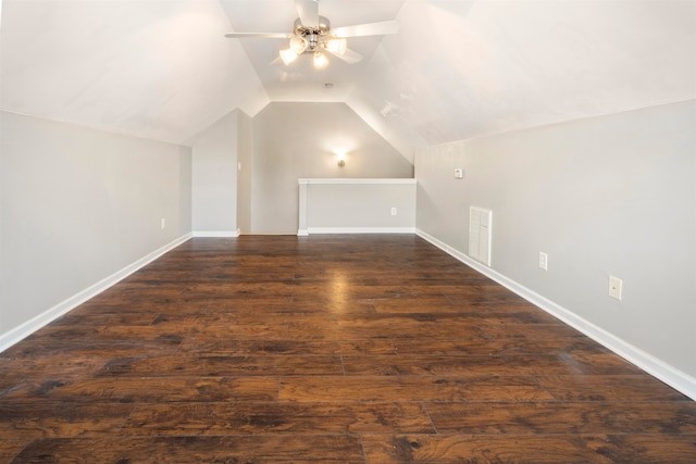 additional living space featuring lofted ceiling, dark wood-type flooring, and ceiling fan