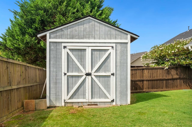 view of outbuilding with a lawn