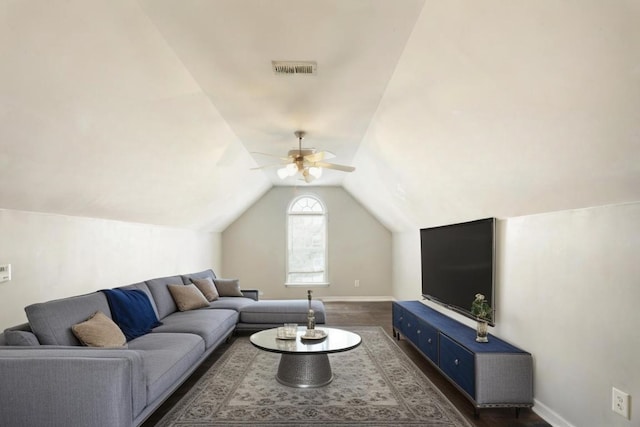 living room featuring ceiling fan, lofted ceiling, and dark wood-type flooring