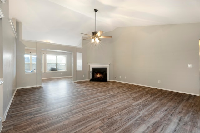 unfurnished living room with high vaulted ceiling, ceiling fan, and dark hardwood / wood-style flooring