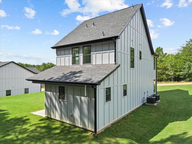 rear view of house featuring a yard