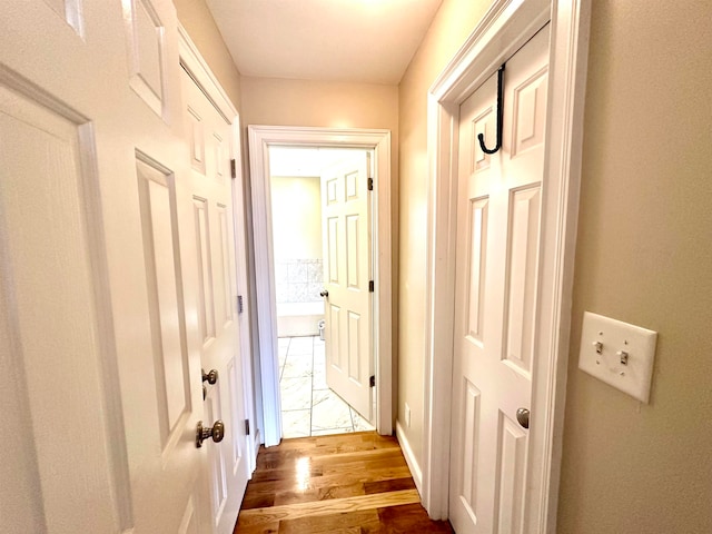 hallway featuring dark wood-type flooring