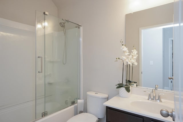 full bathroom featuring enclosed tub / shower combo, vanity, and toilet