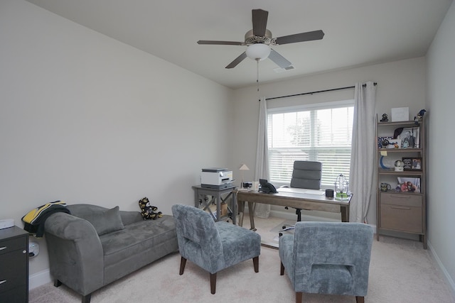 office space with ceiling fan and light colored carpet