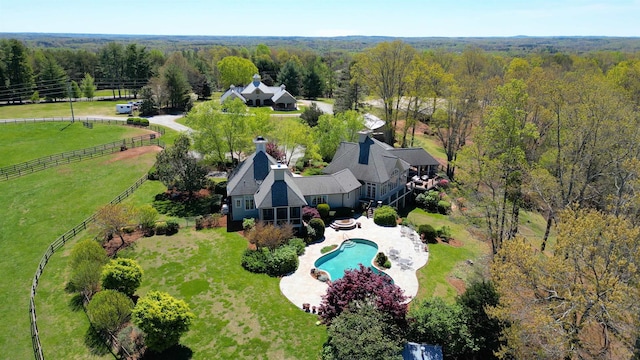 birds eye view of property with a rural view