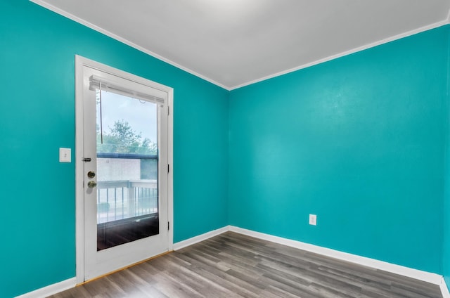 doorway to outside featuring ornamental molding and wood-type flooring