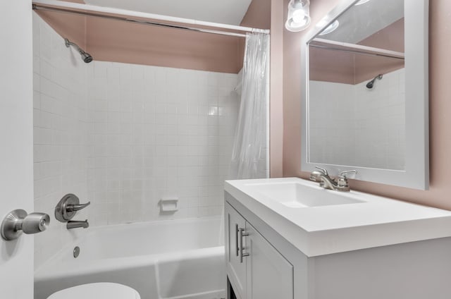 full bathroom featuring shower / tub combo with curtain, vanity, and toilet