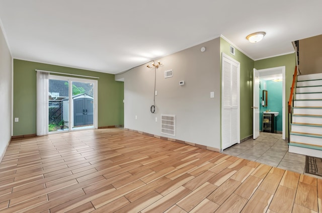 spare room featuring crown molding