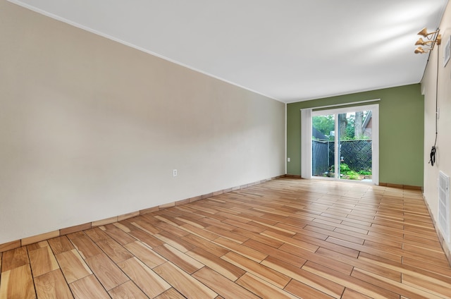 spare room featuring light hardwood / wood-style flooring