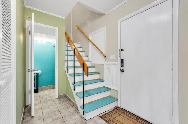 tiled foyer with crown molding