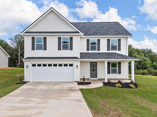 view of front of house with a front lawn and a garage