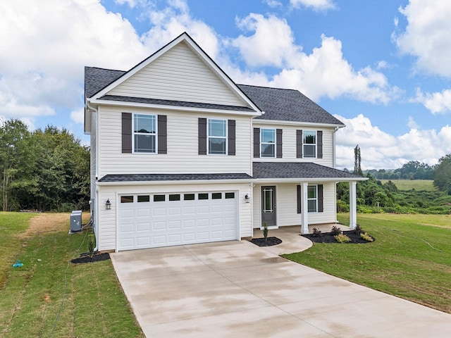 view of front of house with a garage and a front yard