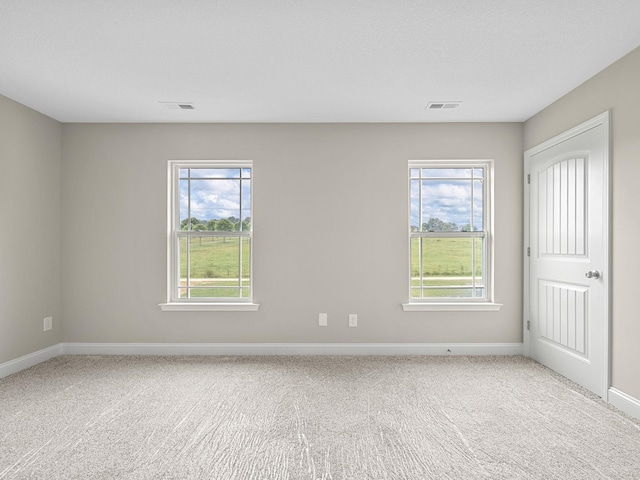 unfurnished room featuring carpet floors