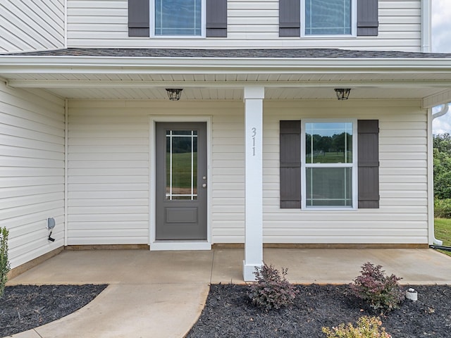 property entrance featuring a porch