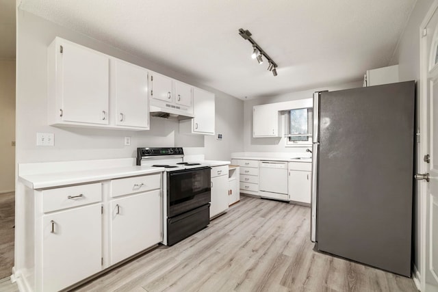 kitchen with white cabinets, white appliances, light hardwood / wood-style floors, and track lighting