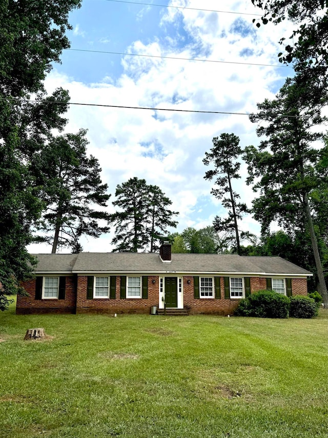 ranch-style home with a front yard