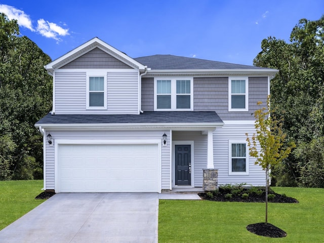 view of front of house featuring a garage and a front yard