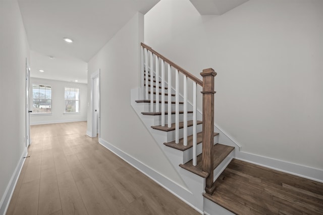 staircase featuring wood-type flooring