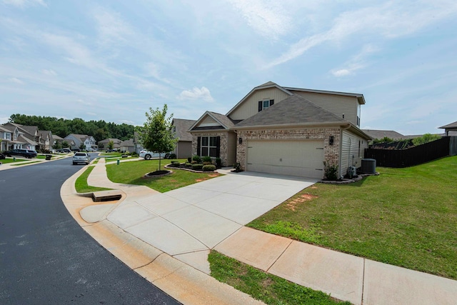 view of front of home featuring central AC unit, a front lawn, and a garage