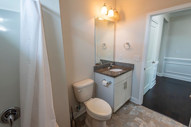 bathroom with toilet and vanity