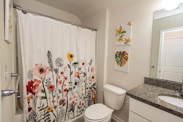 bathroom with toilet, vanity, vaulted ceiling, and a shower with curtain