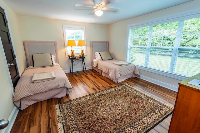 bedroom with wood-type flooring and ceiling fan