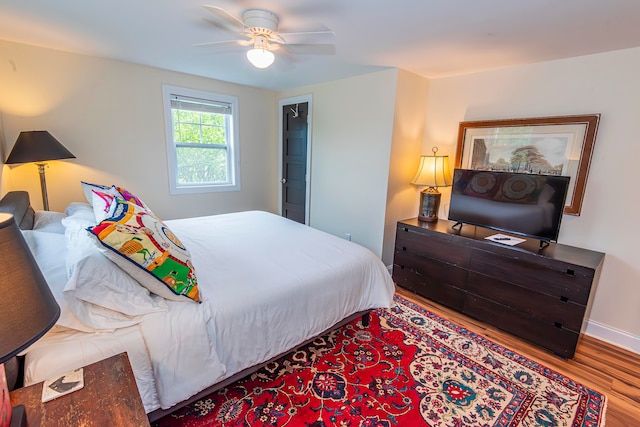 bedroom featuring wood-type flooring and ceiling fan