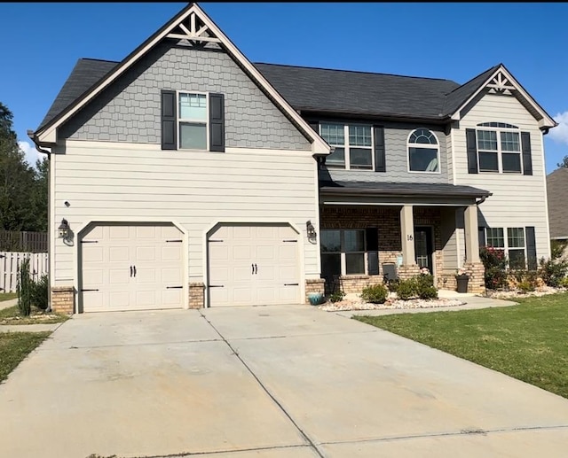 craftsman-style house with a front lawn and a garage