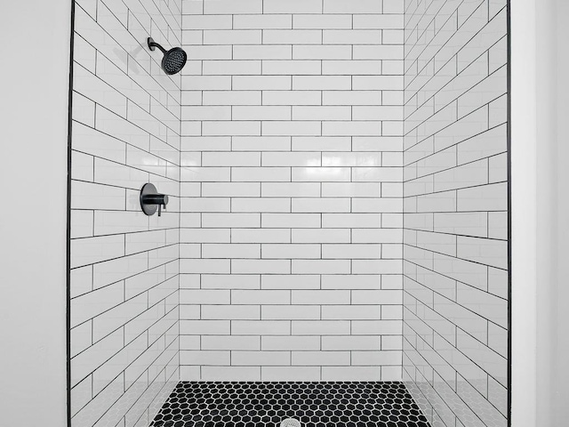 bathroom with tiled shower