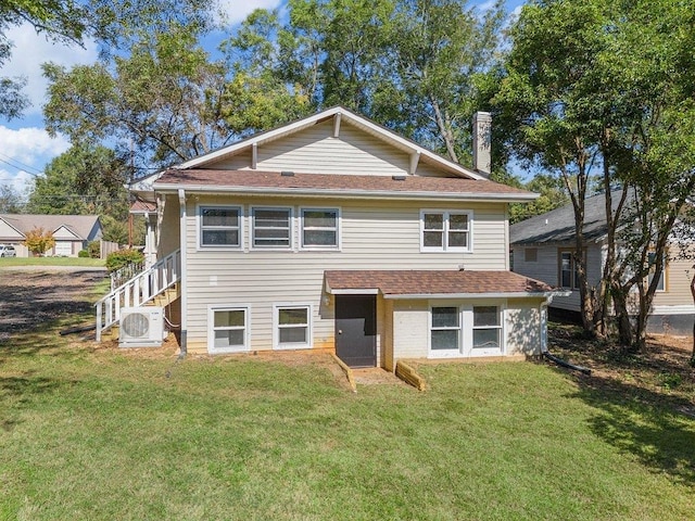 view of front facade featuring ac unit and a front yard