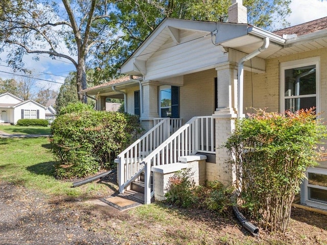 view of side of home with a porch