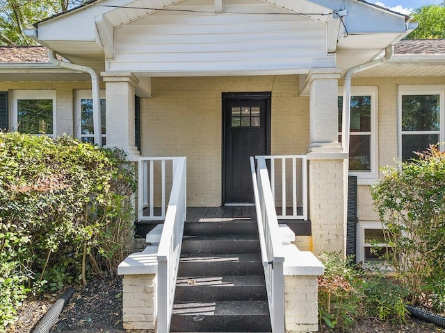 entrance to property with a porch